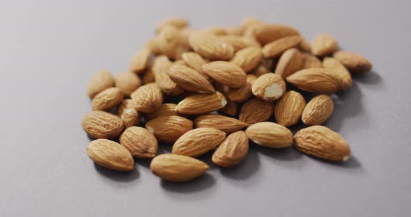 Video of almonds on grey background