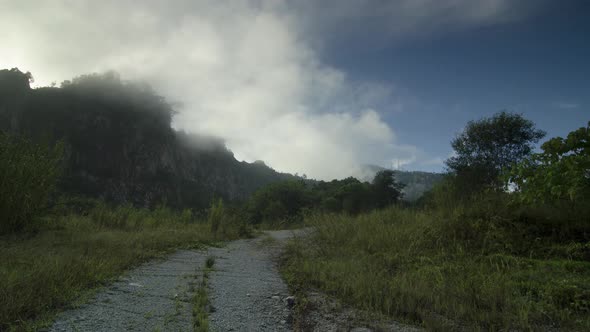 Timelapse morning cloud, mist over the hill