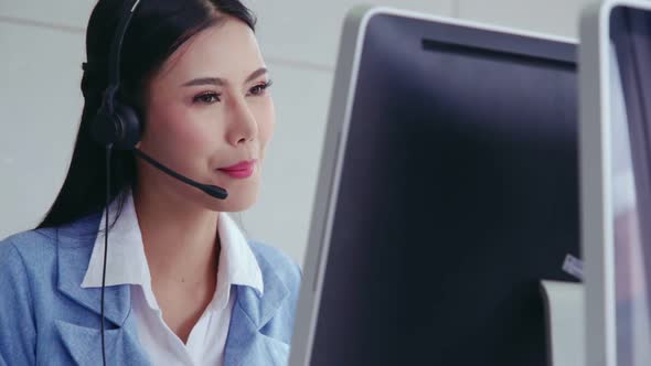 Customer Support Agent or Call Center with Headset Talking to Customer on Phone