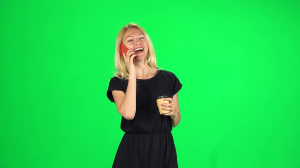 Cute Girl Goes and Speaks By Phone While Drinking a Coffee. Chroma Key