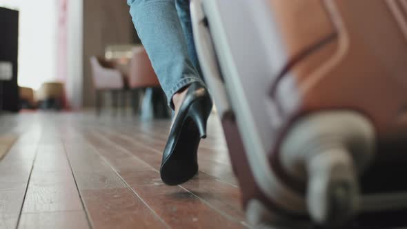 Female Legs in Heels Walking along Hotel Lobby