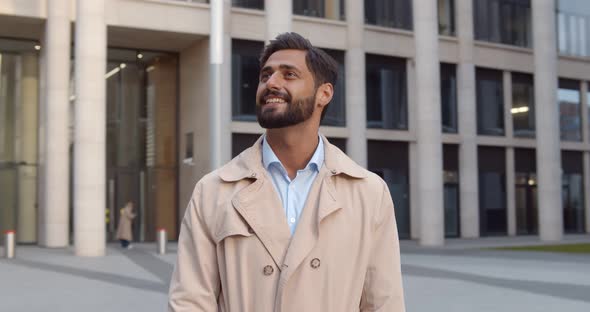 Young Indian Businessman Smiling Happy Standing at City