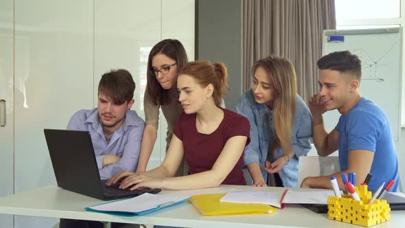 Young People Show Teamwork at the Office