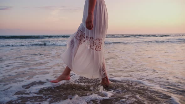 Attractive Woman Enjoying The Beach At Sunset