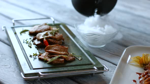 Meat on Dark Green Tray.