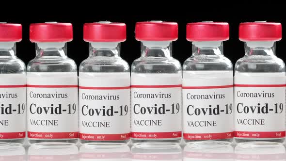 Covid Coronavirus Vaccine Vial on the Table Closeup