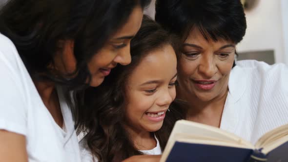 Multi-Generation Family Reading a Book