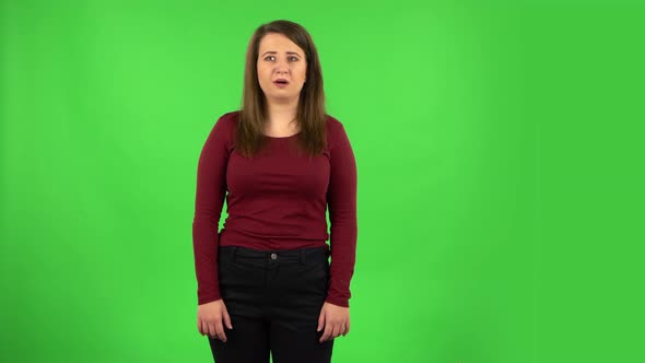 Frightened Girl Says Wow with Shocked Facial Expression. Green Screen