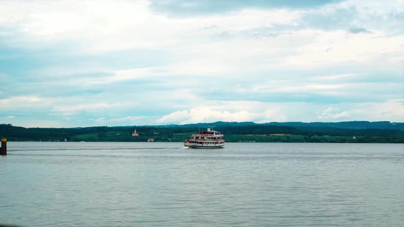 A ship with people sails from the island of Mainau