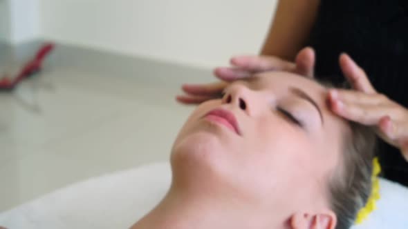 Woman Gets Facial and Head Massage in Luxury Spa