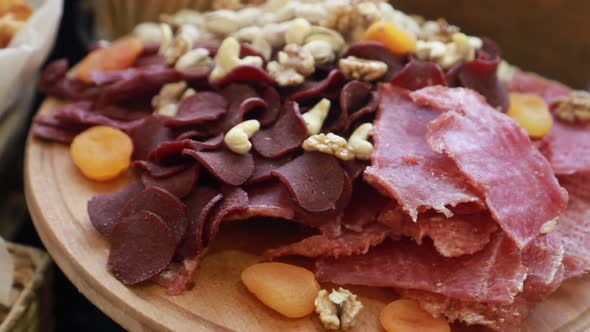 Cutting Sausage and Cured Meat on a Celebratory Table