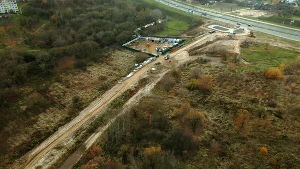 Construction site in a city vacant lot. Photographed in cloudy weather. Aerial photography.