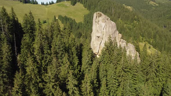 Aerial View of a Picturesque Rock Located Among the Spruce Forest in the Mountains