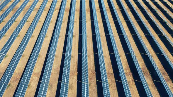 Flying Over Solar Panel Array. Renewable, Eco-friendly Energy Concept.