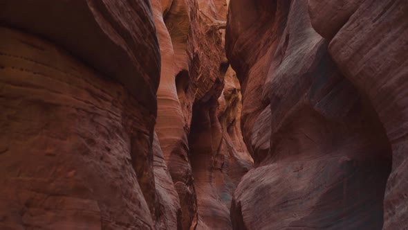 Buckskin Gulch Deep Slot Canyon With Wavy And Smooth Orange Red Stone Rock Walls