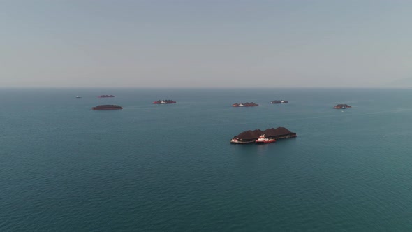 Barge with Coal in the Sea