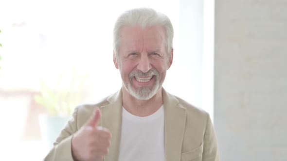 Portrait of Old Man Showing Thumbs Up