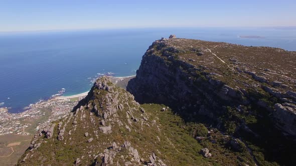 Aerial travel drone view of Cape Town from the top of Table Mountain, South Africa.