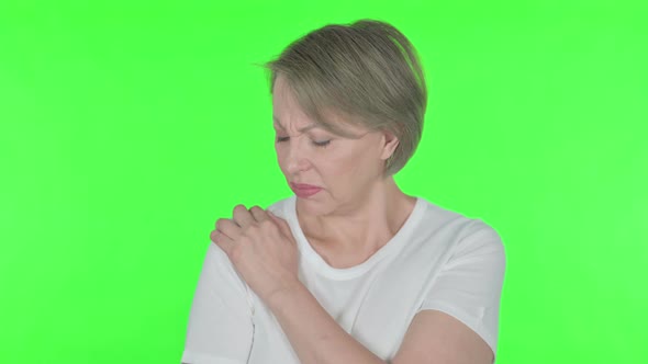 Old Woman Having Toothache on Green Background