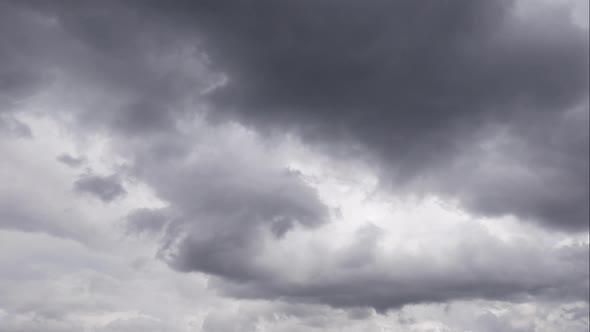 Timelapse Sky and Black Cloud. Dark Grey Storm Clouds. Dramatic Sky. Lighting in Dark Stormy Cloudy