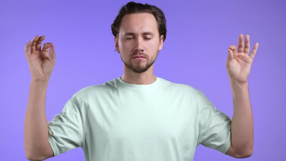 Calm Man in Basic Tshirt Relaxing Meditating