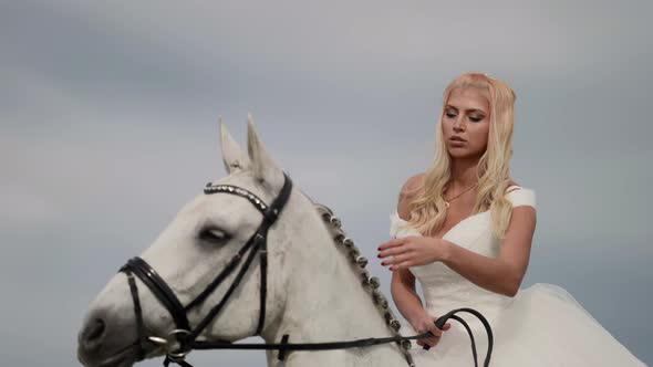 Stunning Beautiful Blonde Woman on Horseback Portrait of Pretty Bride and White Equine