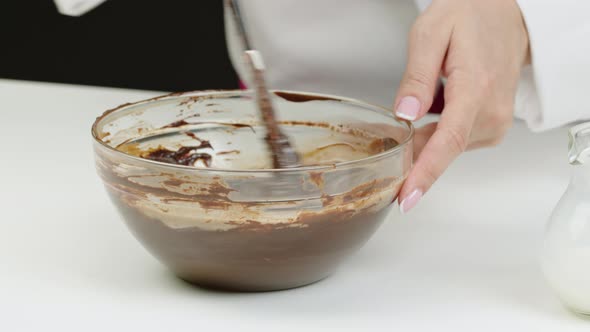 Close-up Making Delicious Chocolate Cream Filling for Praline Sweets and Candies