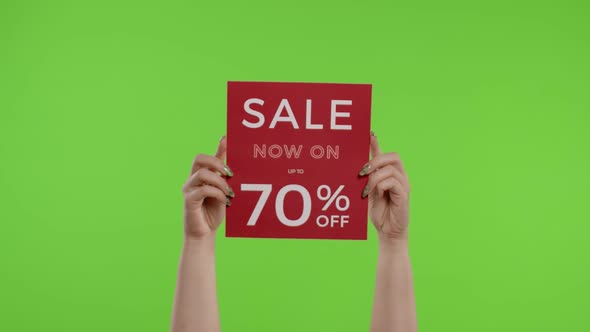 Sale Now On Up To 70 Percent Off Inscription on Paper Sheet in Womans Hands on Chroma Key