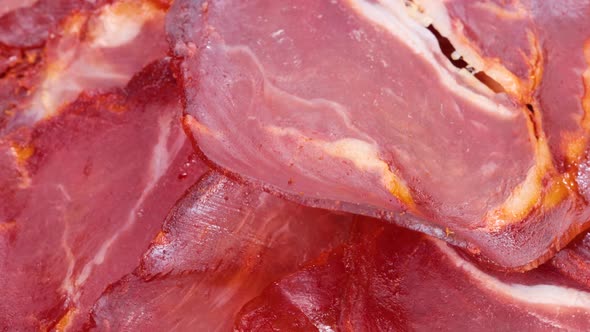 Spanish dish: air dried pork loin slices, macro shot view from above, rotating motion. Close up view