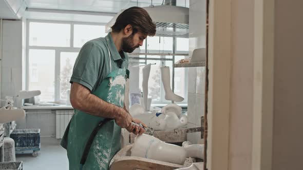 Man Crafting Prosthetic Limb