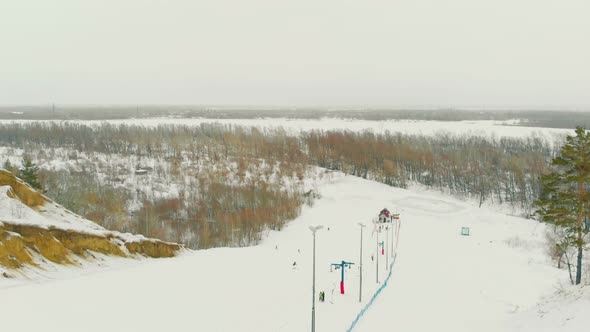 Ski Beginners Track and Rope Tow on Snowy Hill Upper View