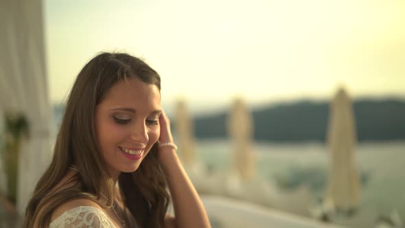 Woman Outside at Sunset in Santorini