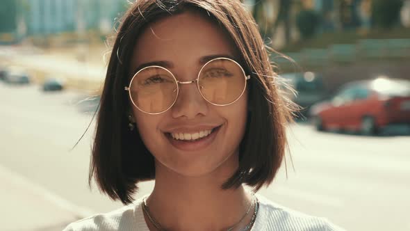  Trendy girl posing in the street background