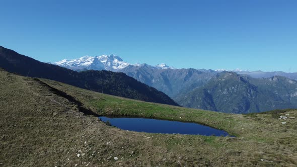 Aerial View Of Monte Rosa Over A Lake