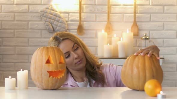 Woman Looking at Pumpkins Handmade Work, Preparation for Halloween, Slow-Mo