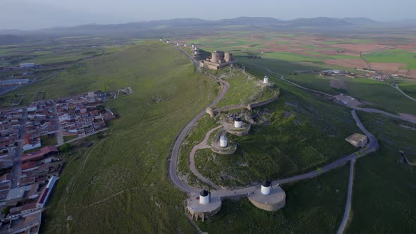 The Castle of La Muela with many mills in Consuegra. Aerial Shot Of Spain.