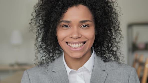 Smiling African Businesswoman Looking at Camera