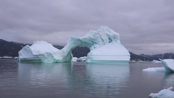 Ilulissat, Greenland. Massive icebergs floating near the shores of a glacier.