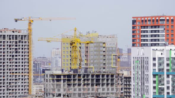 Construction of the House with a Crane and People