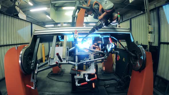 Robotic Arm Precisely Welding Bike Frame at a Bicycle Plant