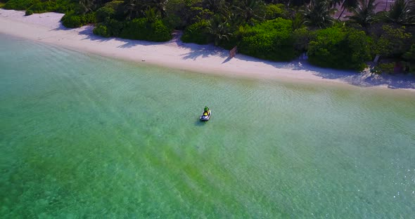 Beautiful aerial copy space shot of a white sandy paradise beach and aqua blue ocean background in 4