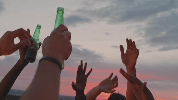 Unrecognizable People Partying Outside on Summer Evening