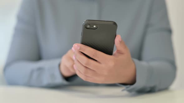 Close Up of African Woman Using Smartphone Mobile