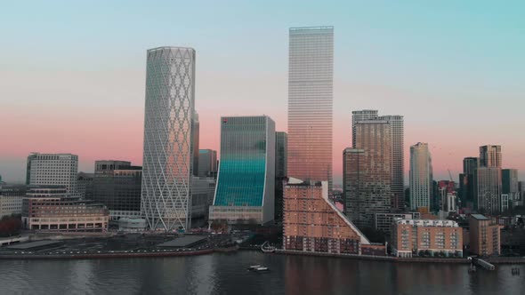 Slider Drone aerial shot of London Canary Wharf at sunset