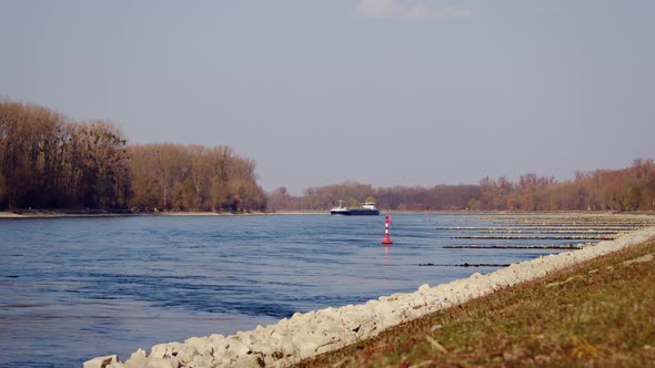 Industrial transport ship sailing with gas or liquids on the Rhine near Karlsruhe, Germany. Sunny we