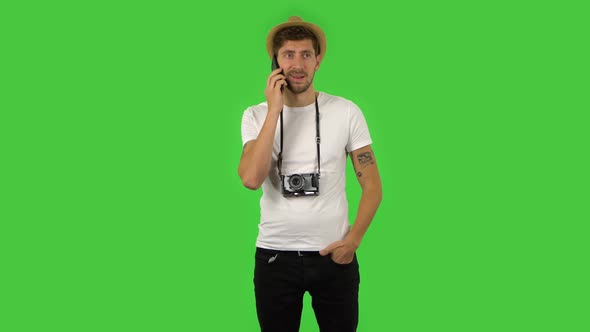 Confident Guy Is Talking for Mobile Phone. Green Screen