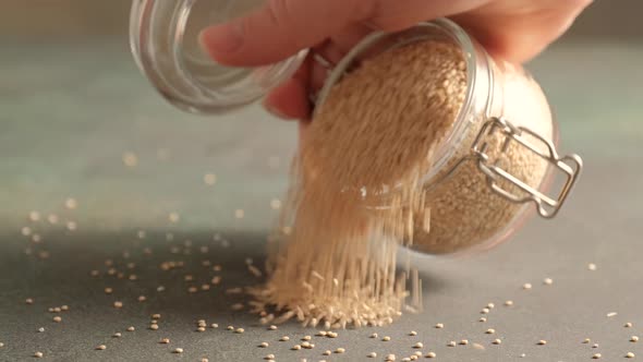 White raw quinoa in glass jar