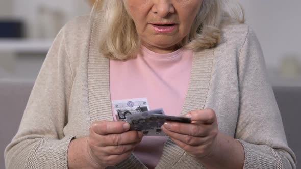 Unhappy Old Woman Counting Euro Banknotes, Small Pension, Lack of Money, Poverty