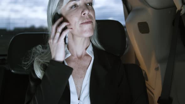 Vertical Motion of Woman Talking on Smartphone