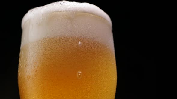 Foam Rising in Glass of Beer